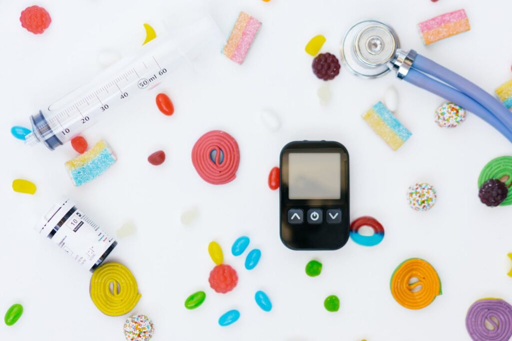 Crafting Captivating Headlines: Your awesome post title goes here Flat lay of diabetes management tools and colorful candies on white background.