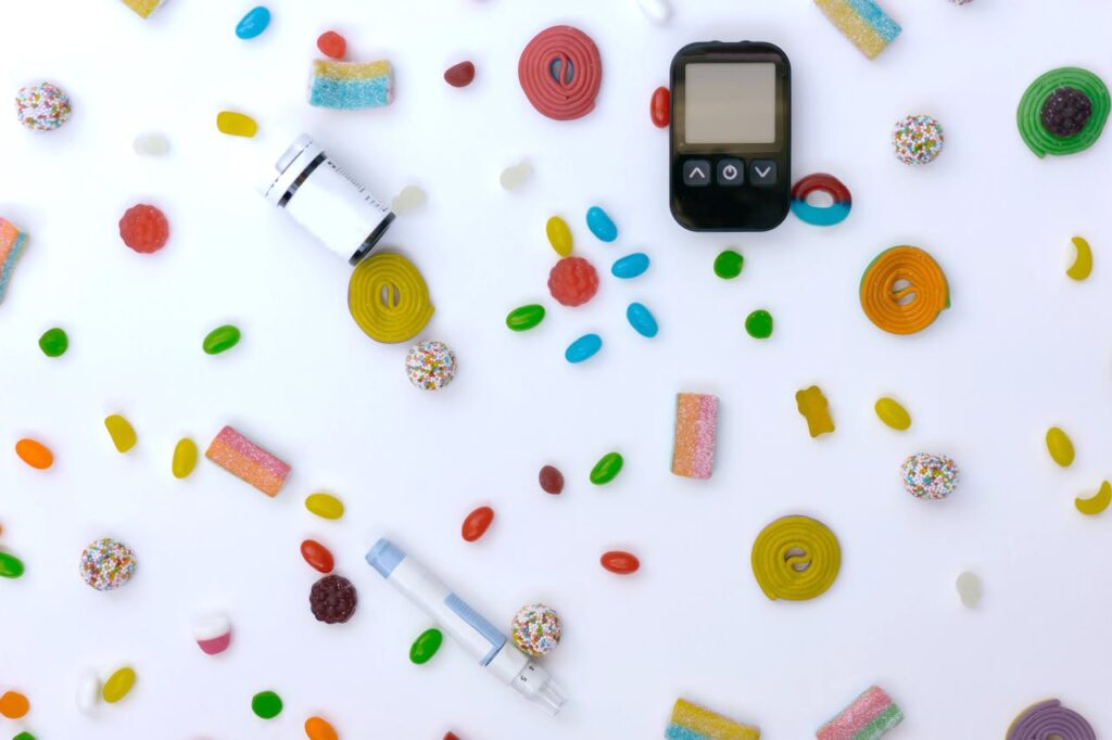 The Art of Drawing Readers In: Your attractive post title goes here Scattered candies with glucose meter and syringe indicating diabetes and healthcare.